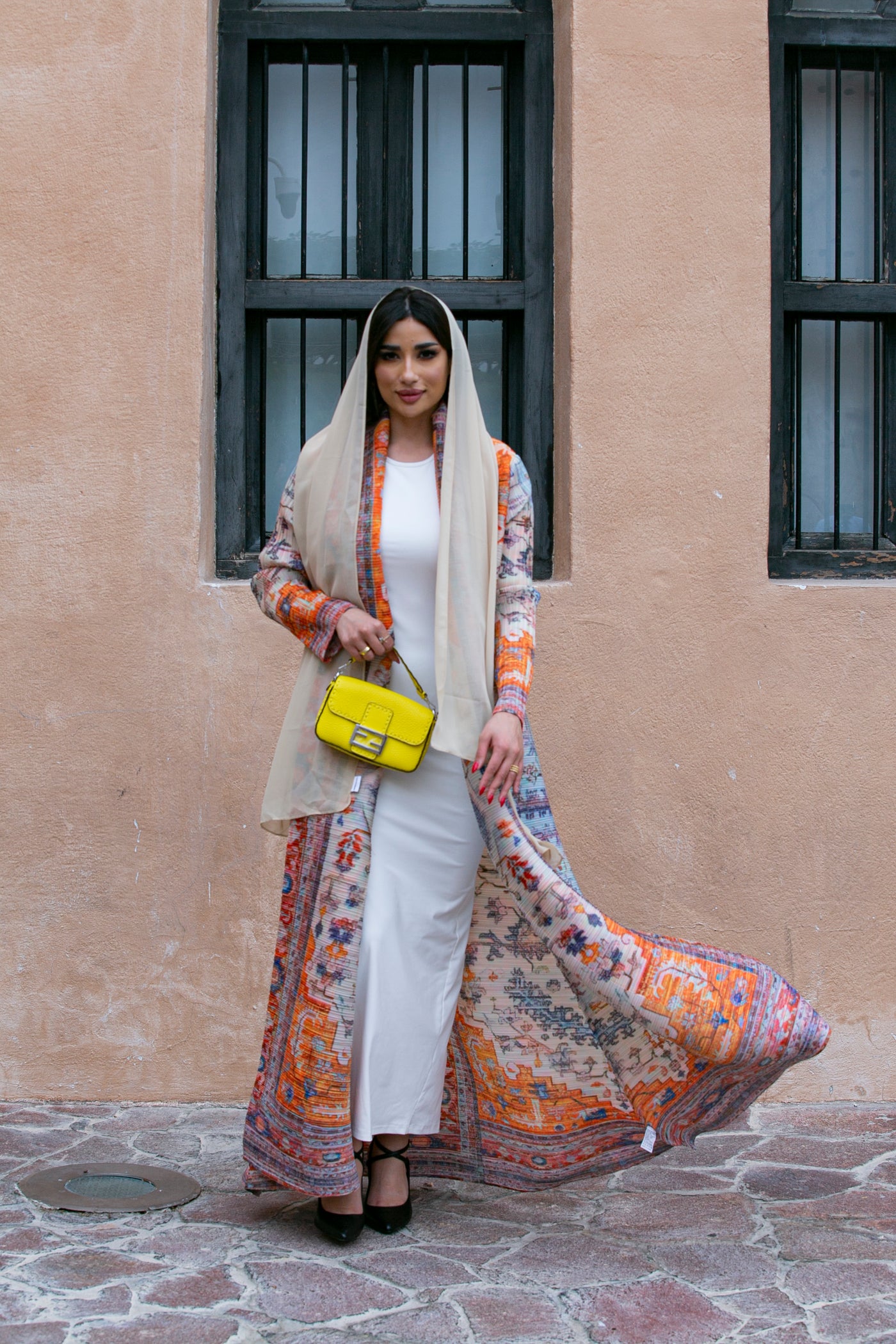 Haneen alsaify X Becosy  in Light orange  pleated abaya with floral print