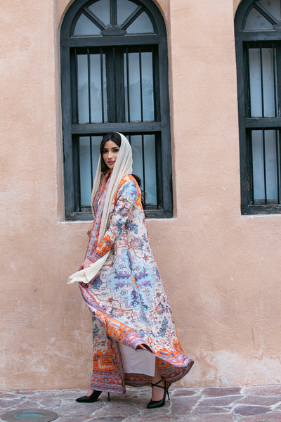Haneen alsaify X Becosy  in Light orange  pleated abaya with floral print