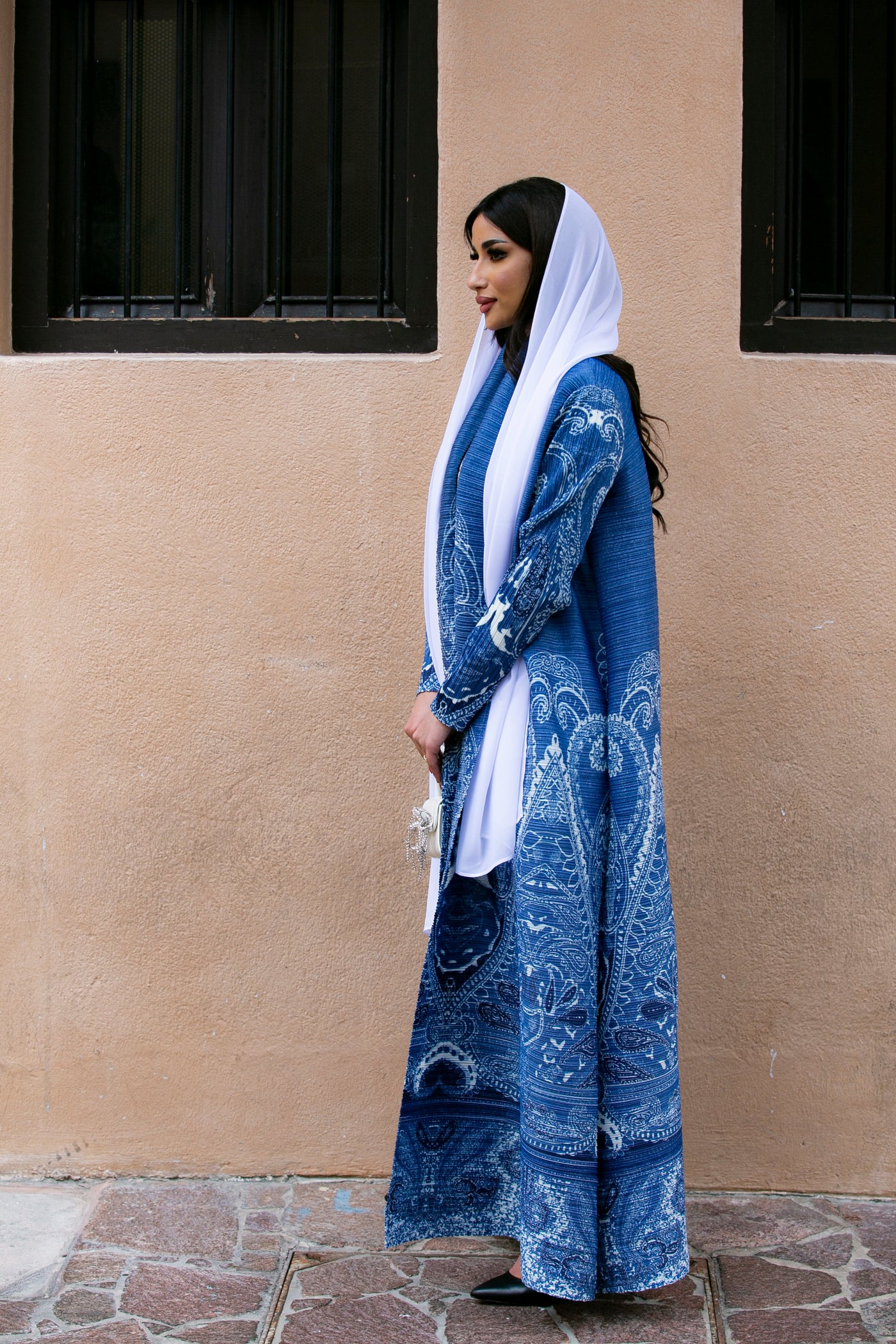 Haneen alsaify X Becosy  in Navy blue pleated abaya with floral print