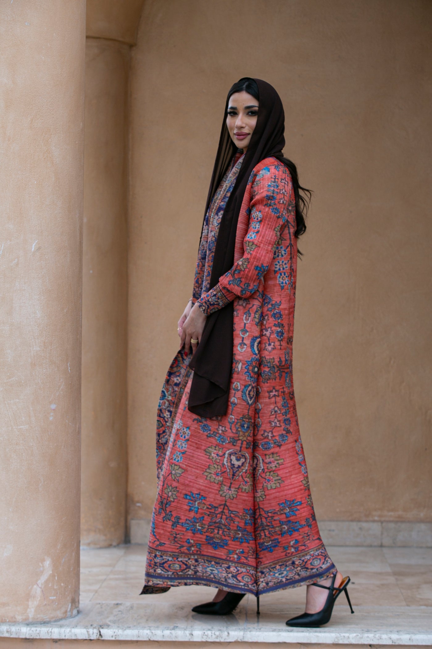 Haneen alsaify X Becosy in  Orange pleated abaya with floral print